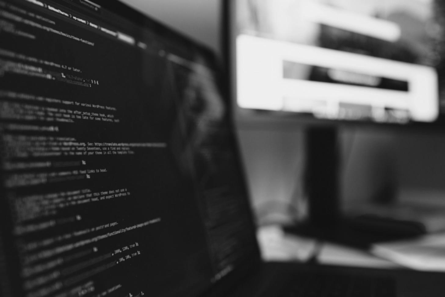 Training session showing developers learning new testing methodologies with hands-on computer work and instructor guidance